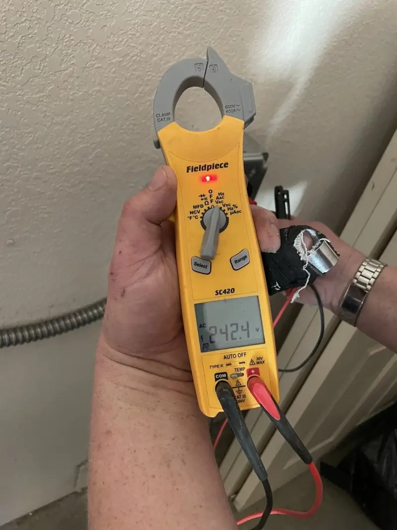 Voltage testing with clamp meter during Circuit Breaker Repair in Landis